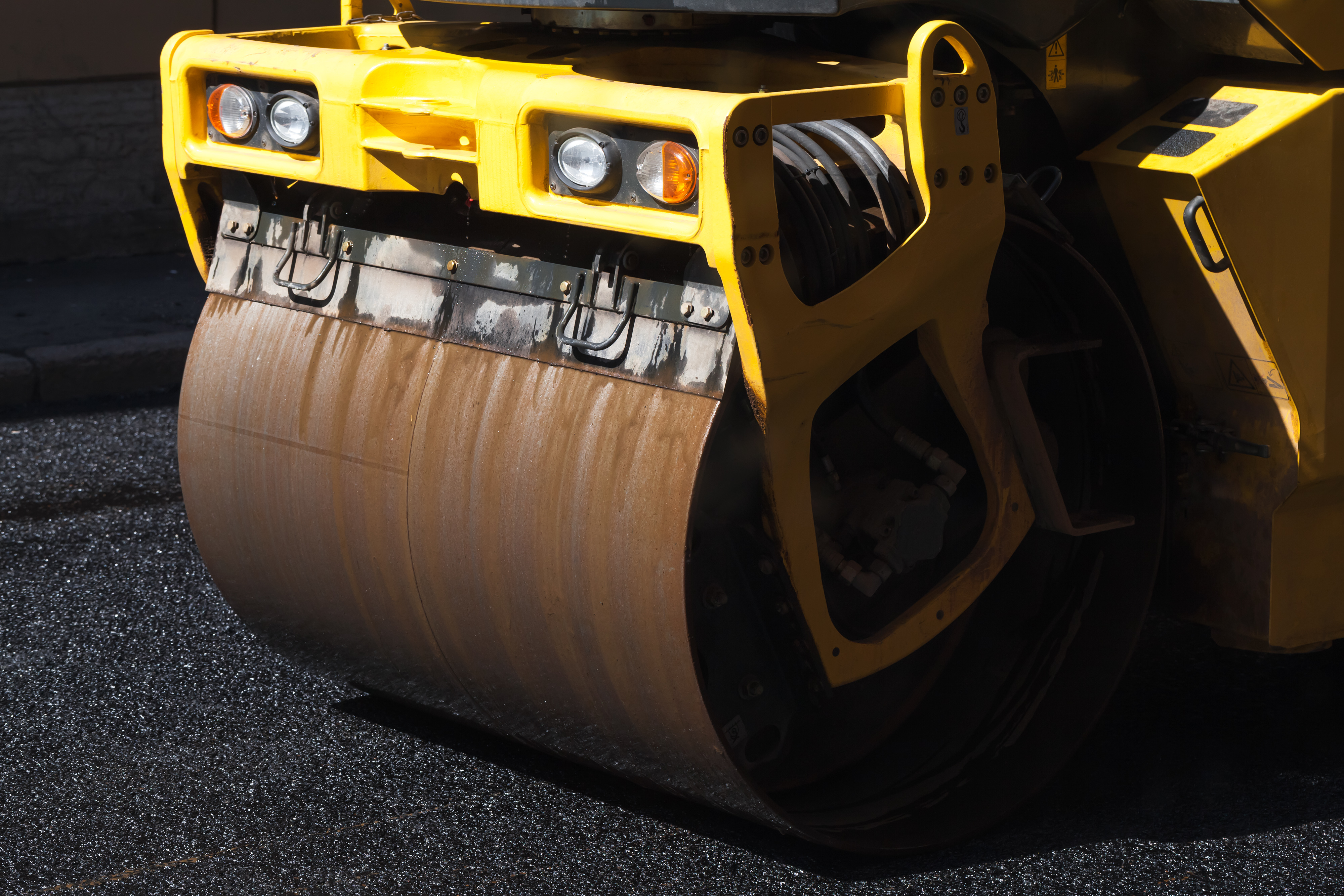 Fragment of yellow roller, urban road is under construction 3B Training