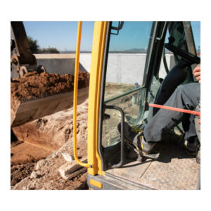 Groundworker carrying out excavation on construction site.