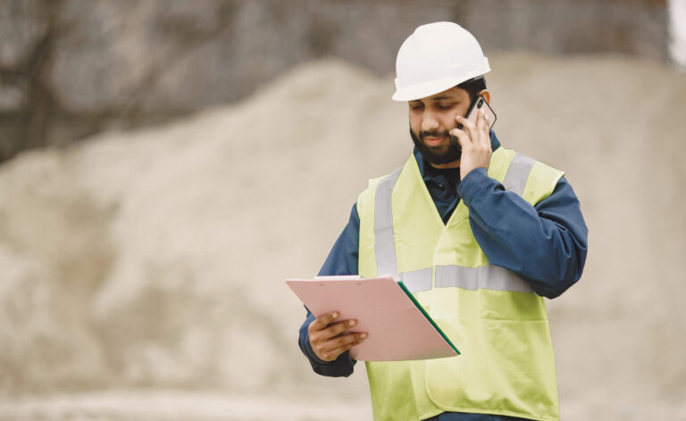 Worker controlling lifting operations onsite after taking an NVQ Level 5