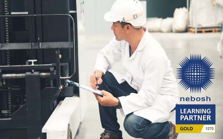 Employee following NEBOSH health and safety checks