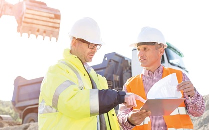 Construction workers on site doing their Occupational Health and Safety NVQ