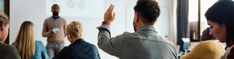 Delegate with hand up in 3B Training classroom course