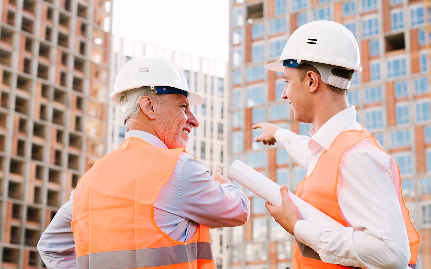 Supervisor and Manager discussing construction project