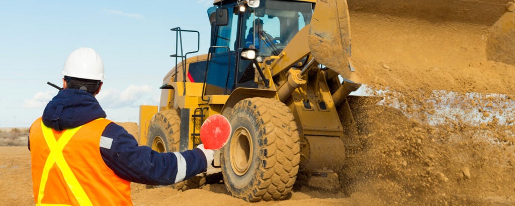 Banksman completing construction works