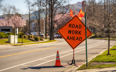 Road sign warns of road work ahead