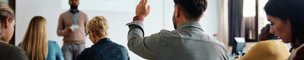 Delegates asking questions in a Health and Safety Training class