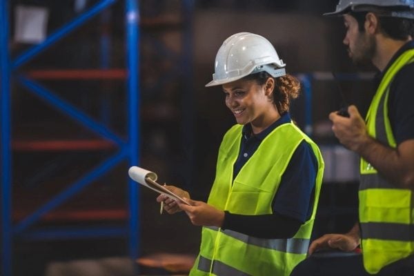 Woman looks at clipboard