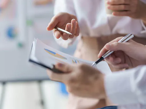 Health and safety advisors looking at documents.