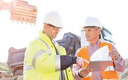 Construction workers on site doing their Occupational Health and Safety NVQ