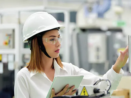 Health and Safety Manager performing safety checks after a NEBOSH Health and Safety course.