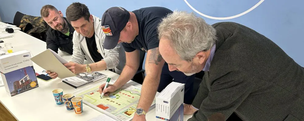 Delegates look over materials at desk