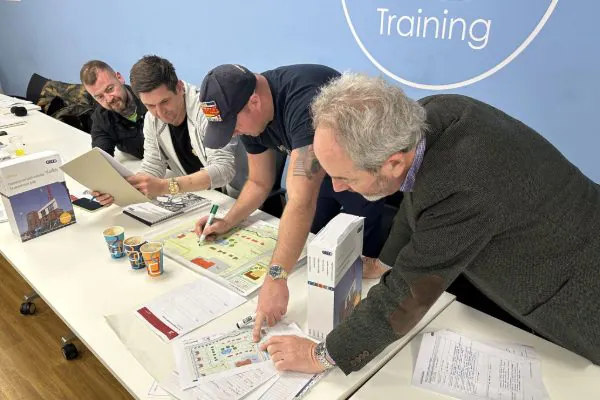 Delegates look over training materials