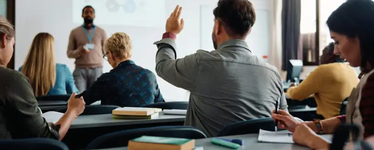 Delegates asking questions in a Health and Safety Training class